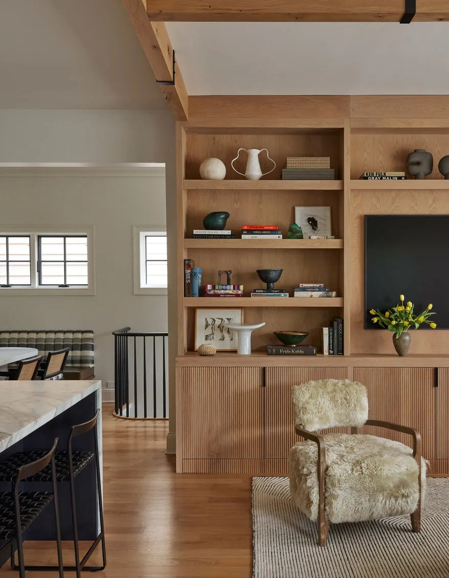 Built-in storage adds order while keeping the room warm.