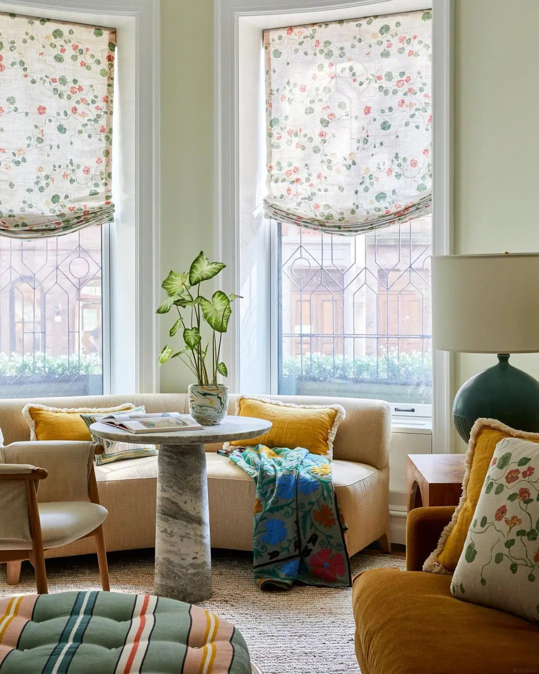 Patterned textiles make a sofa corner feel personal.