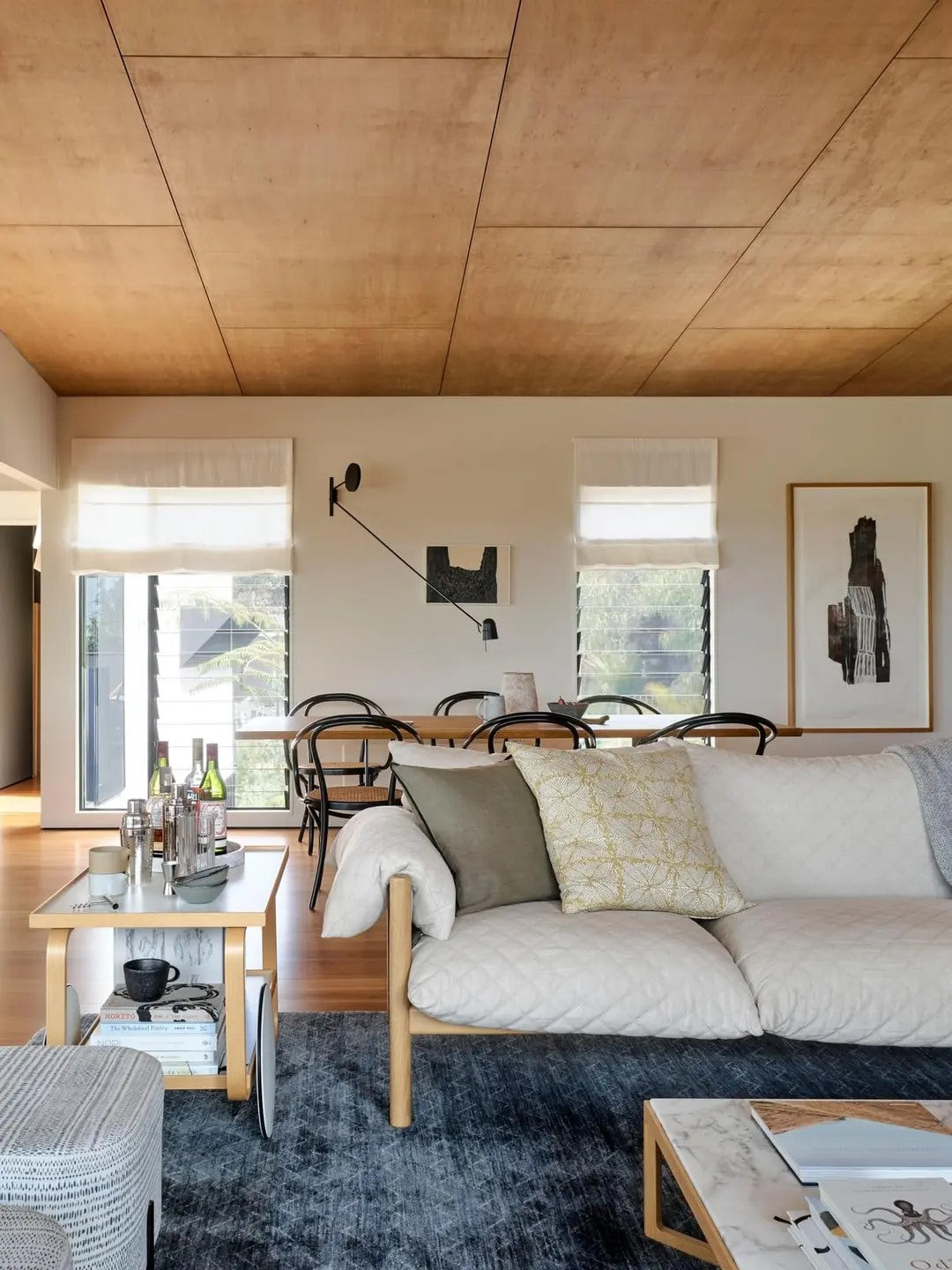A relaxed sofa zone can still feel tailored with the right material balance.