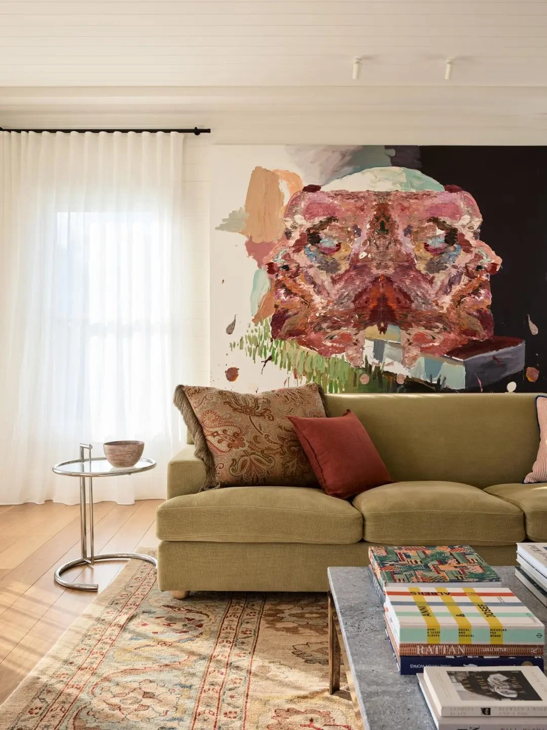A pair of sconces frames the sofa and adds evening structure.