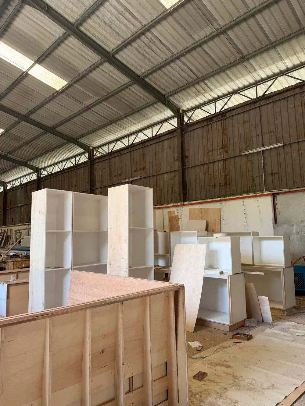 Custom kitchen cabinet production in a factory workshop