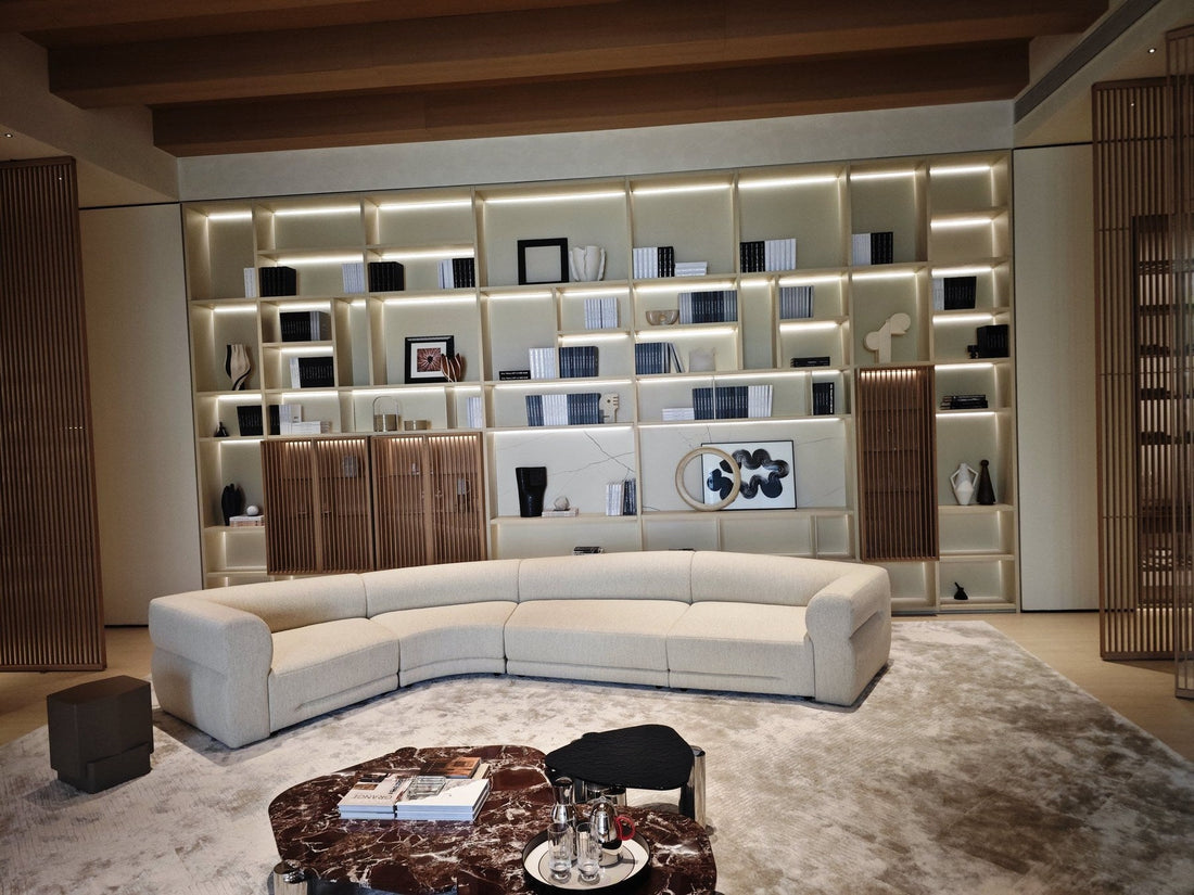 Arcaya showroom living room setting with sofa and display shelving