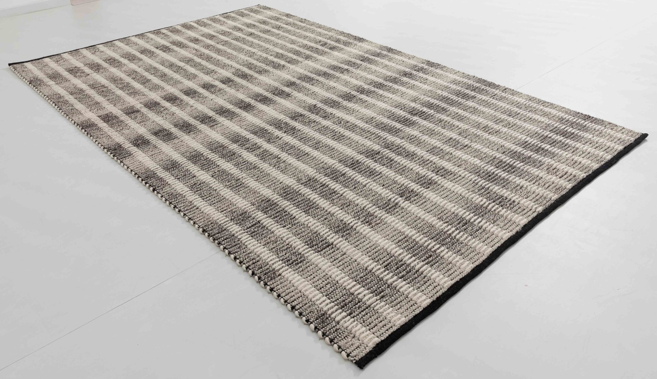 Harta Arbor Area Rug in a finished interior.