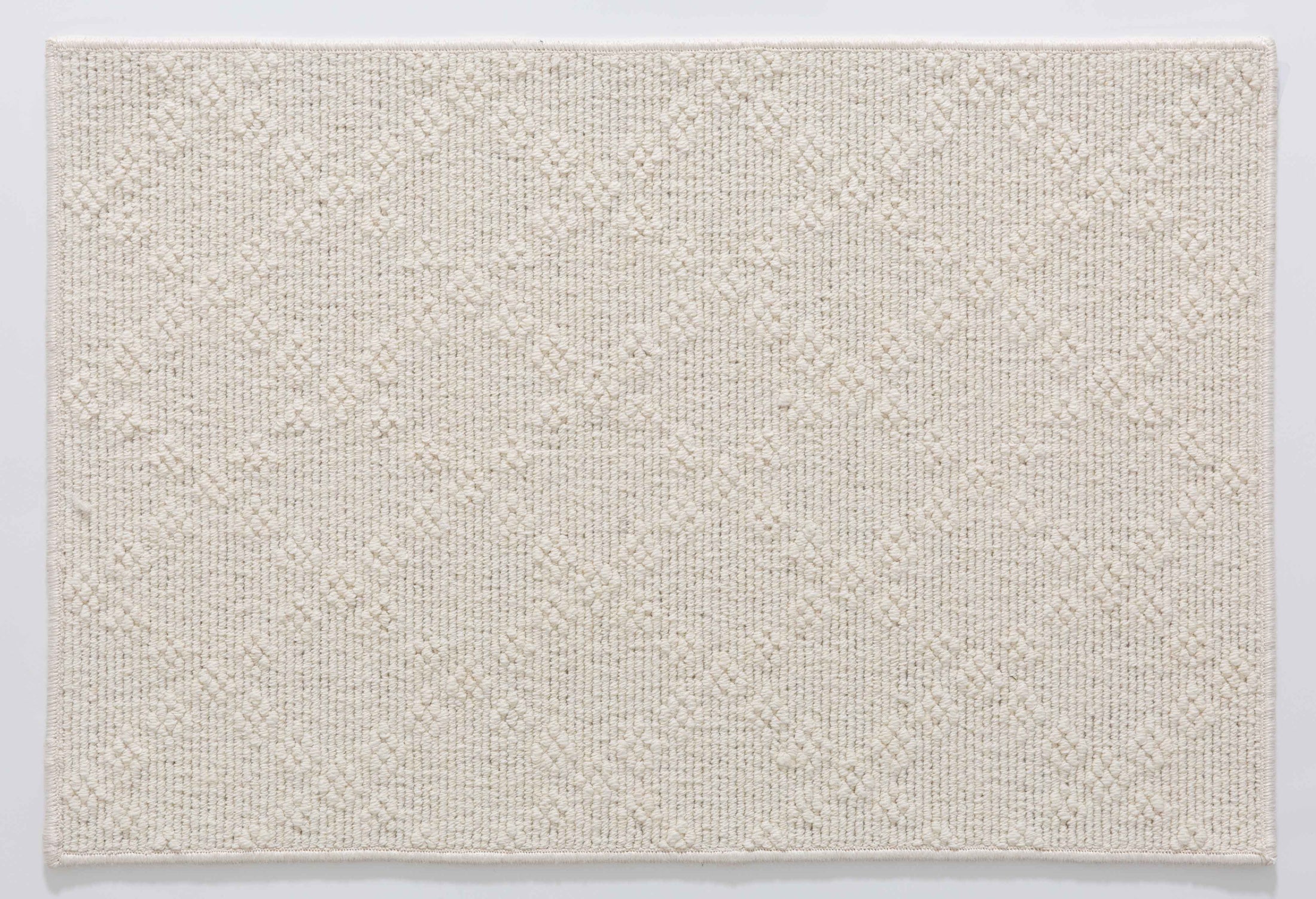 Wheat Dawn Area Rug in a finished interior.