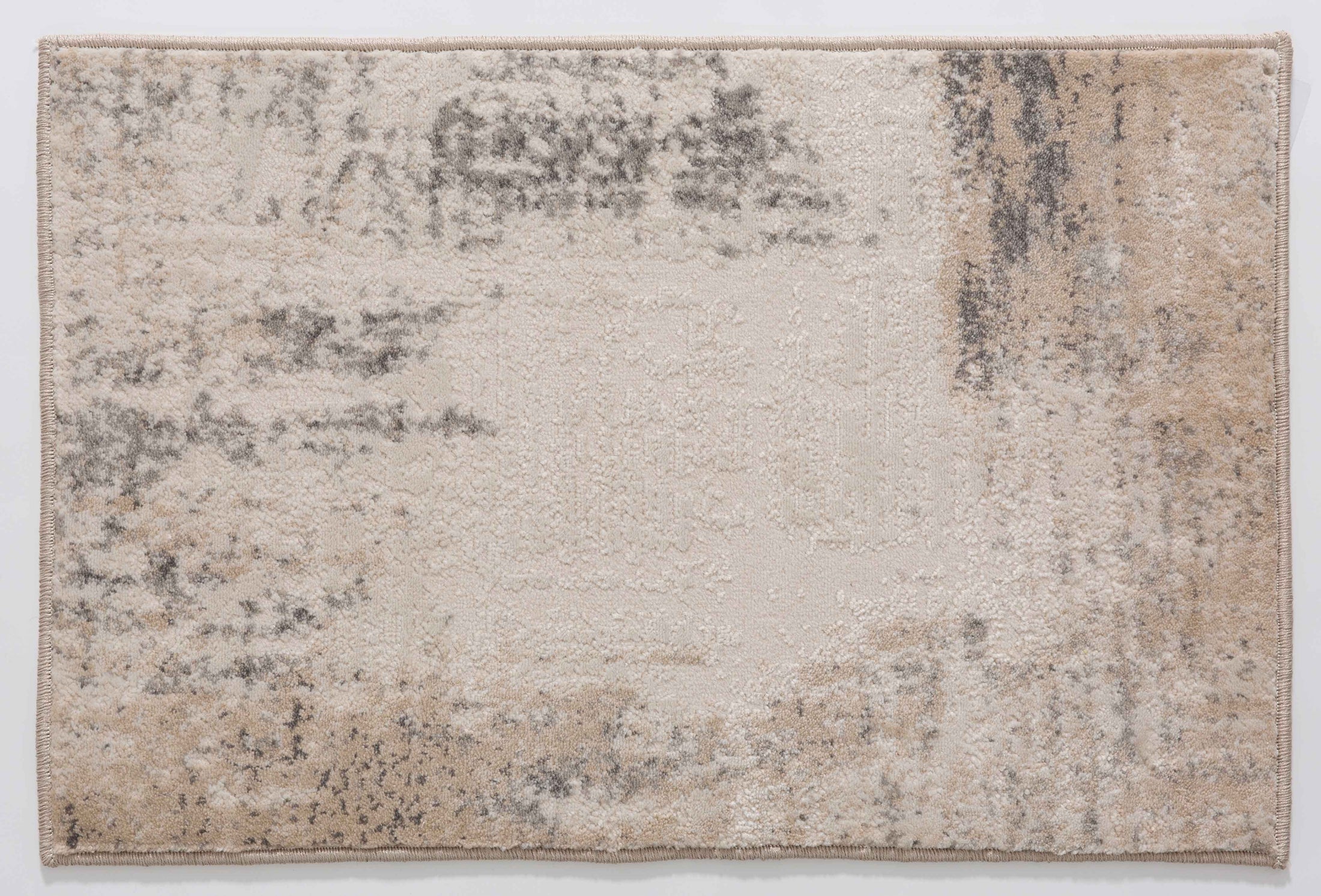 Whisper Ember Area Rug in a finished interior.