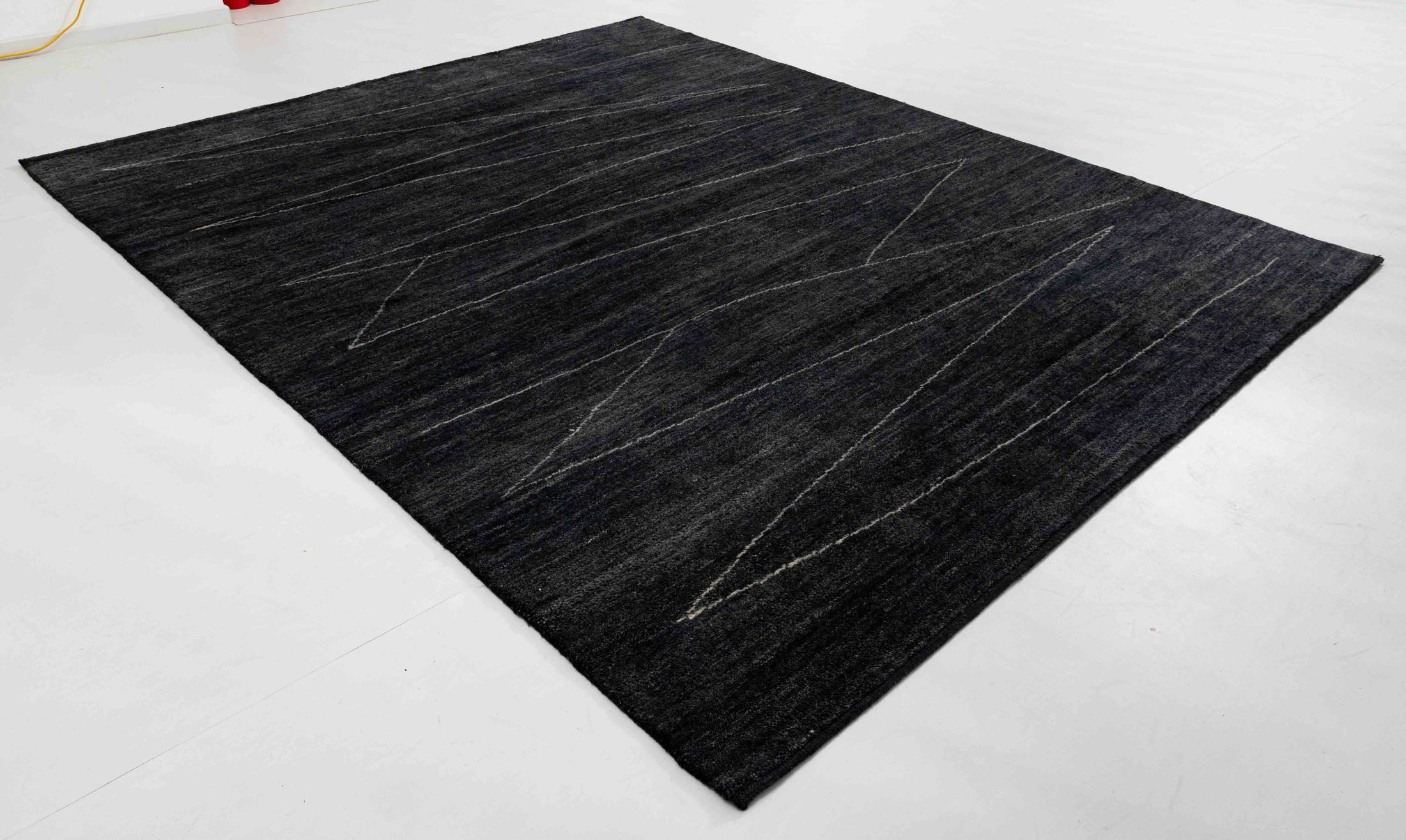 Stone Cairn Area Rug in a finished interior.