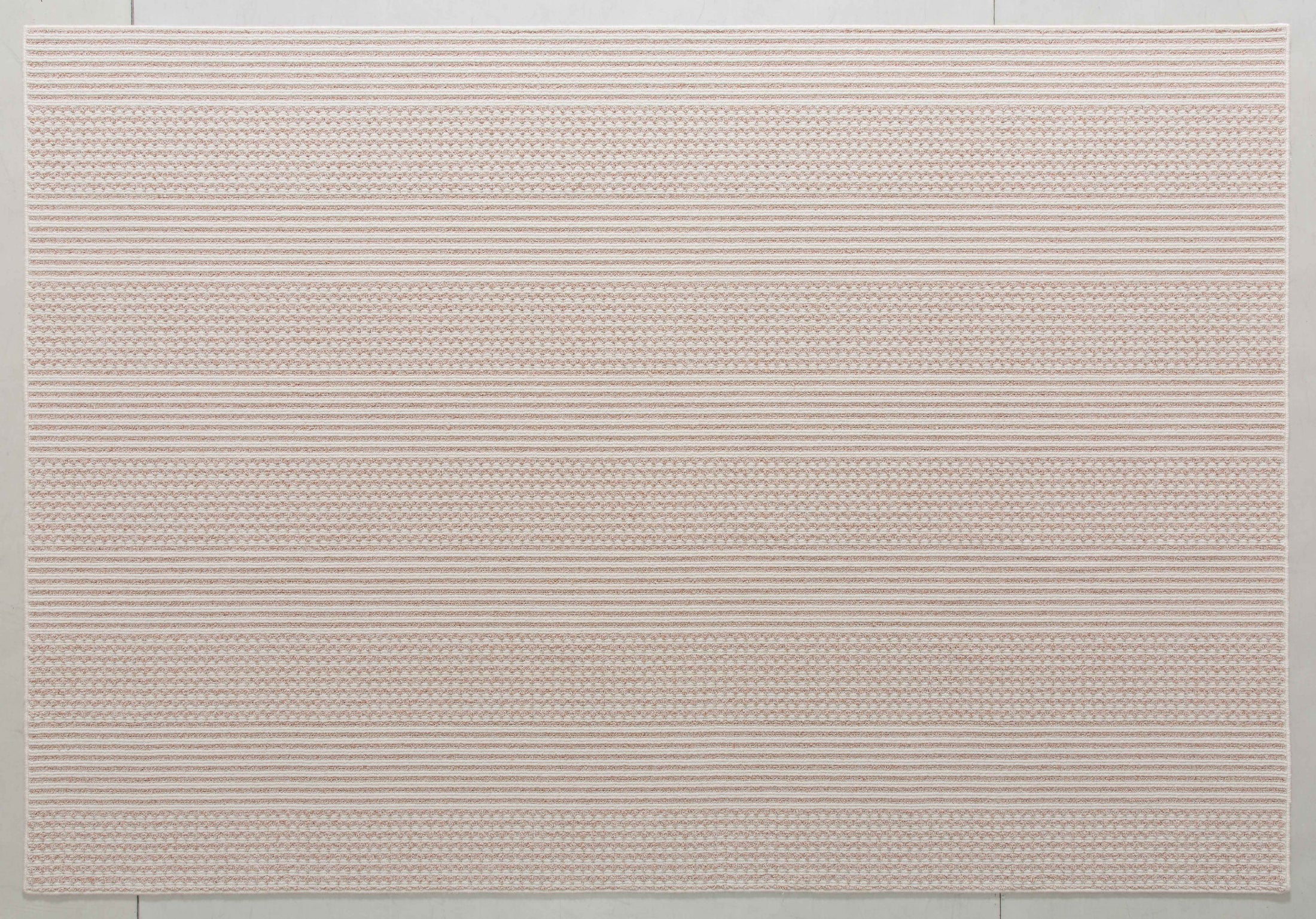 Midsummer Atlas Area Rug in a finished interior.