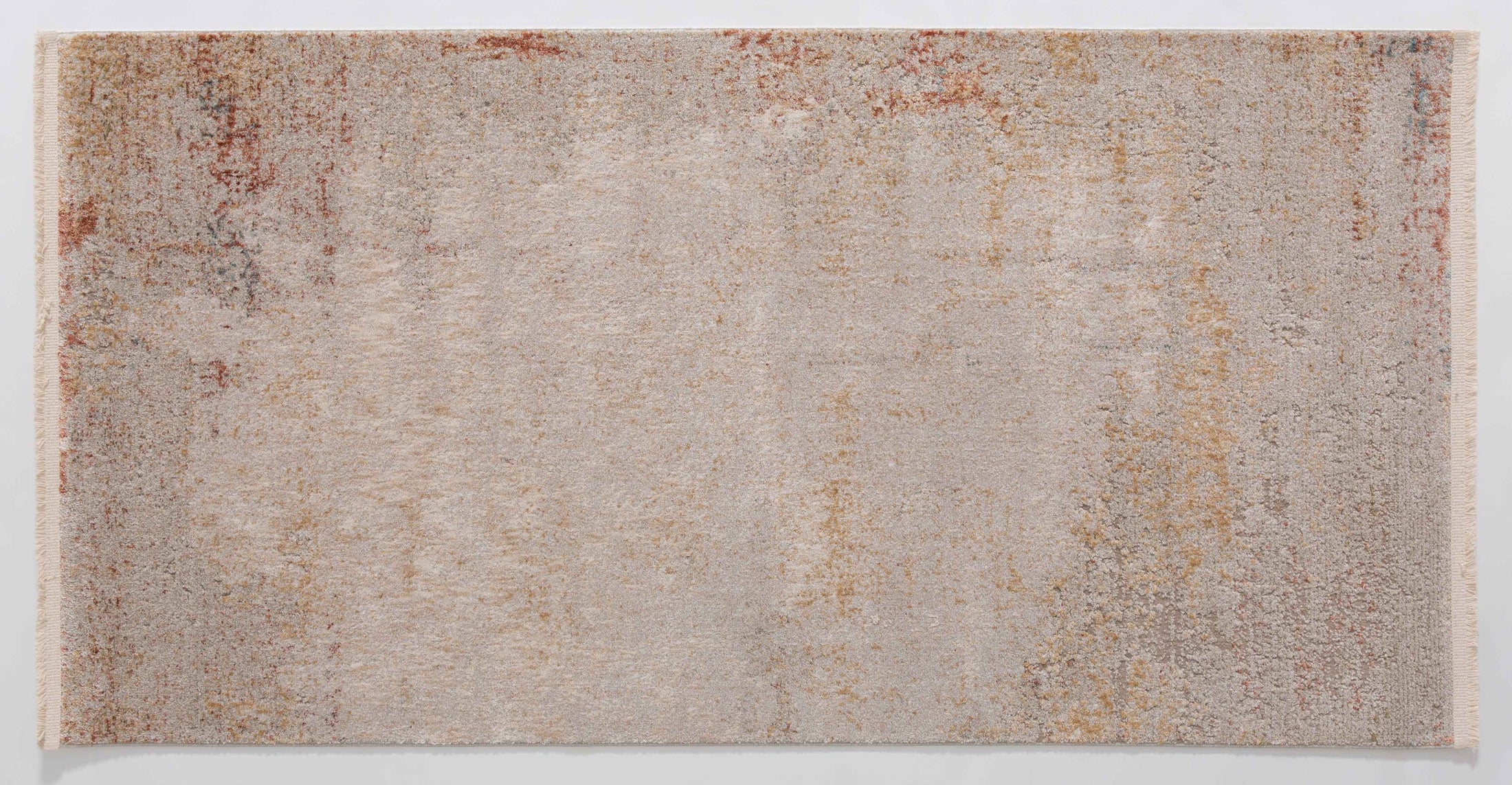 Infinitude Dune Area Rug in a finished interior.