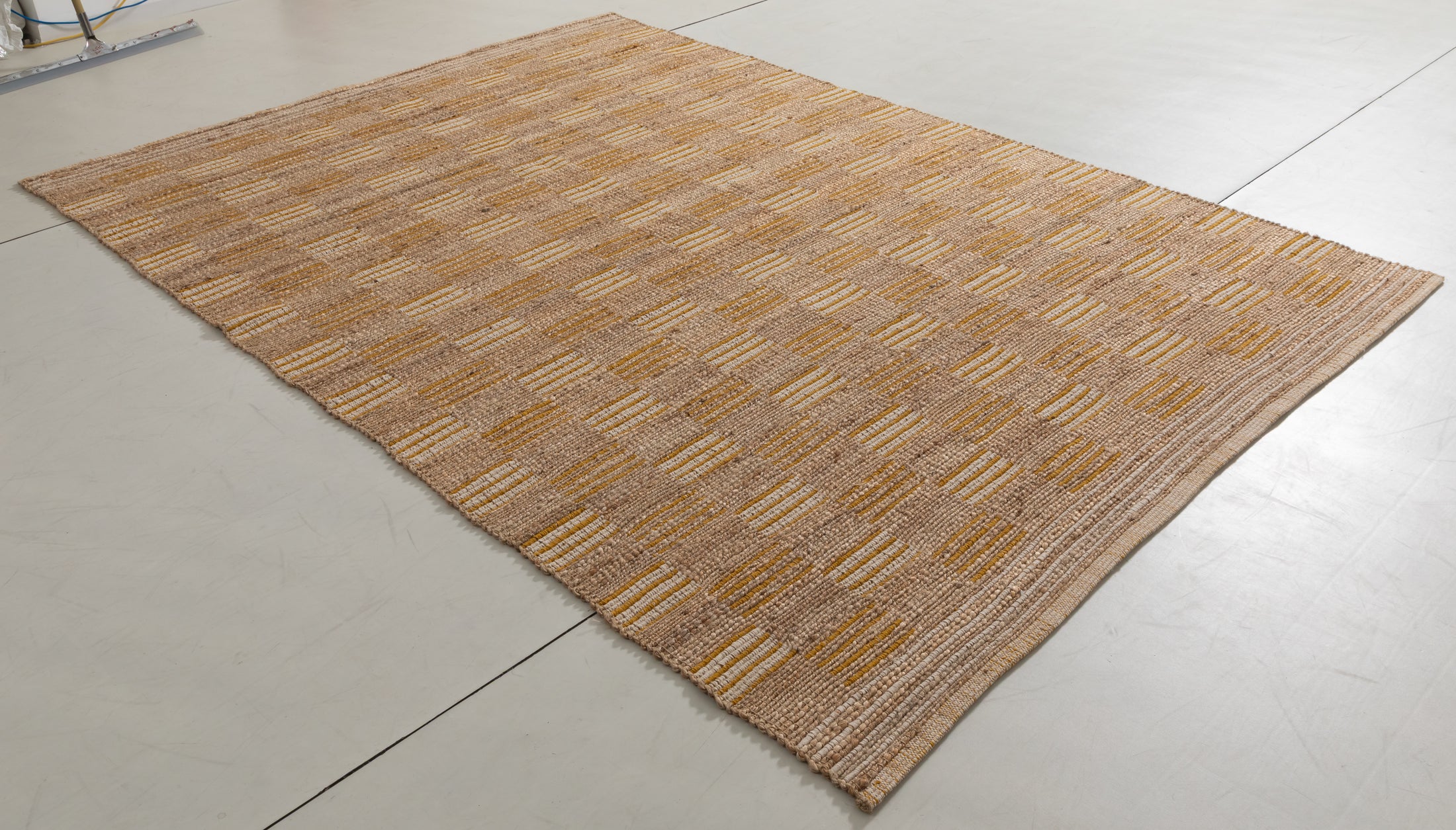 Huegem Cairn Area Rug in a finished interior.