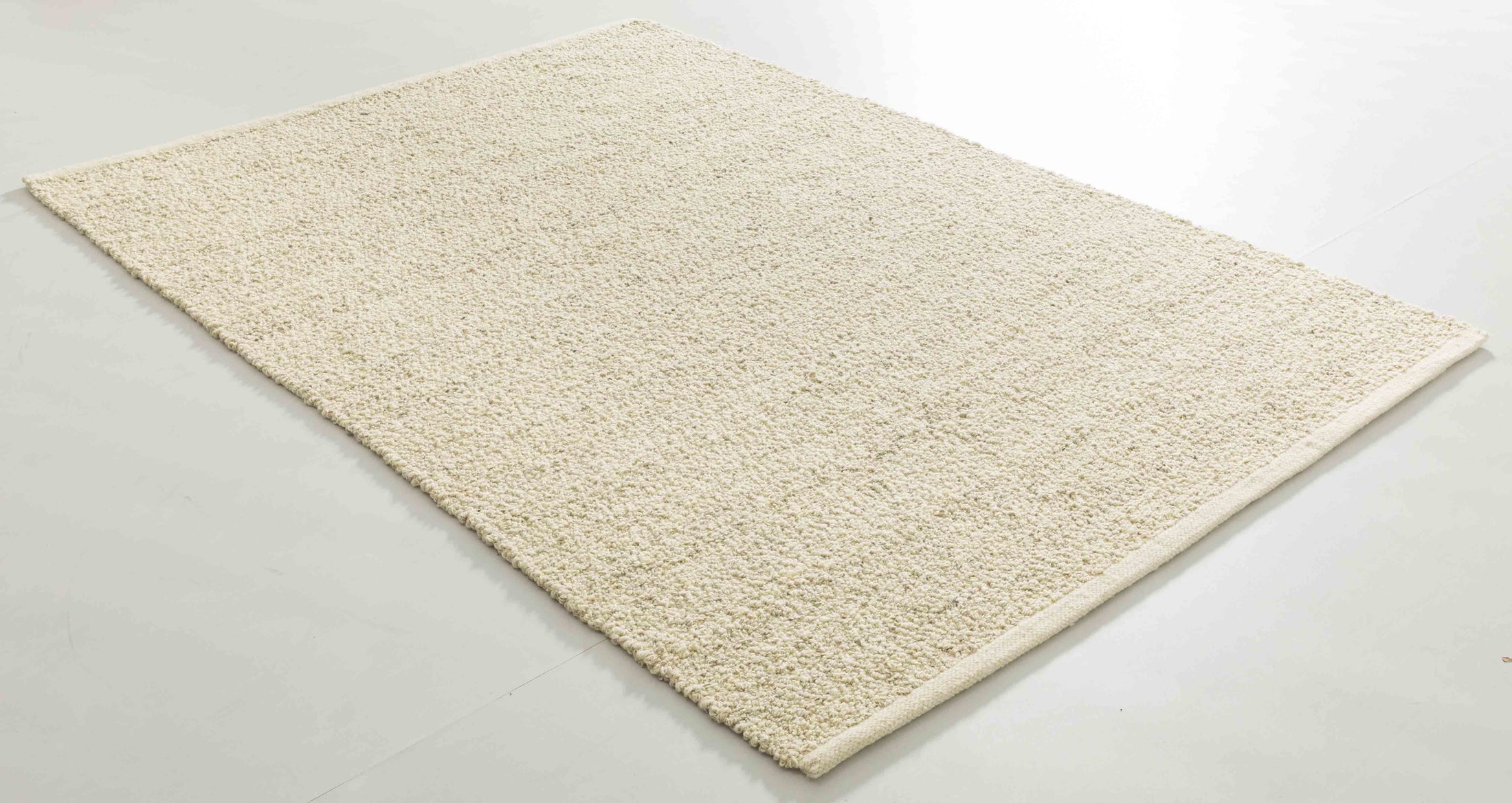 Hug Atlas Area Rug in a finished interior.