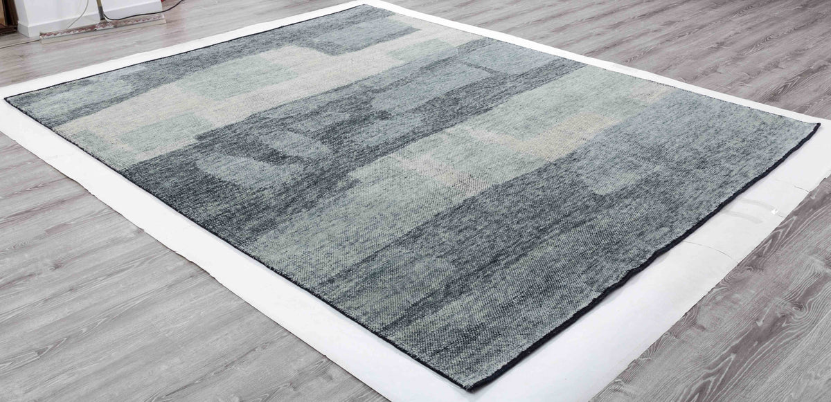Inkstone Arc Area Rug in a finished interior.