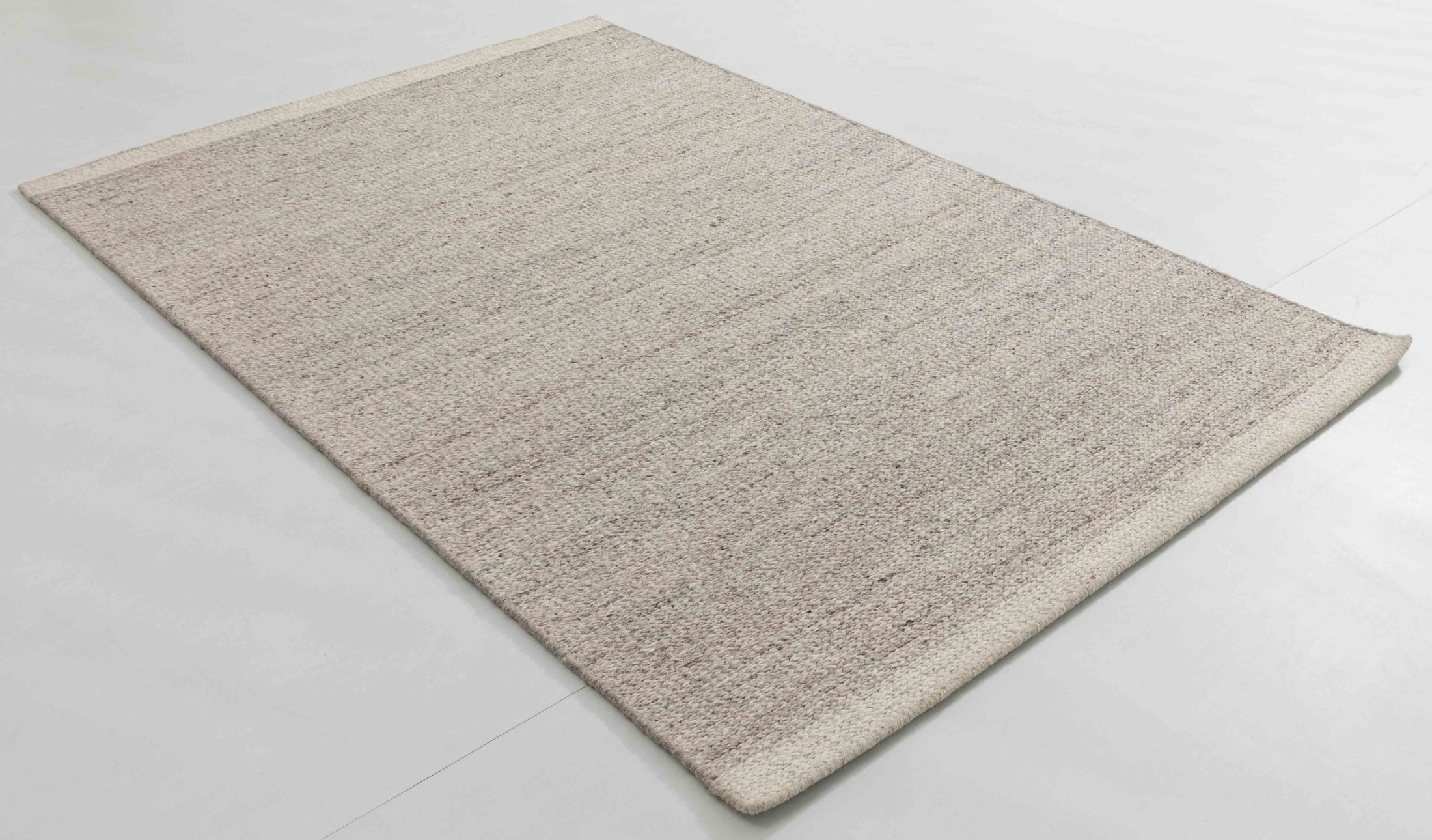Bus Atlas Area Rug in a finished interior.