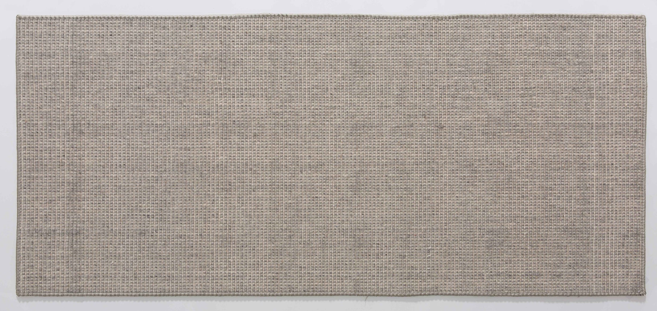Minimalist Bloom Area Rug in a finished interior.