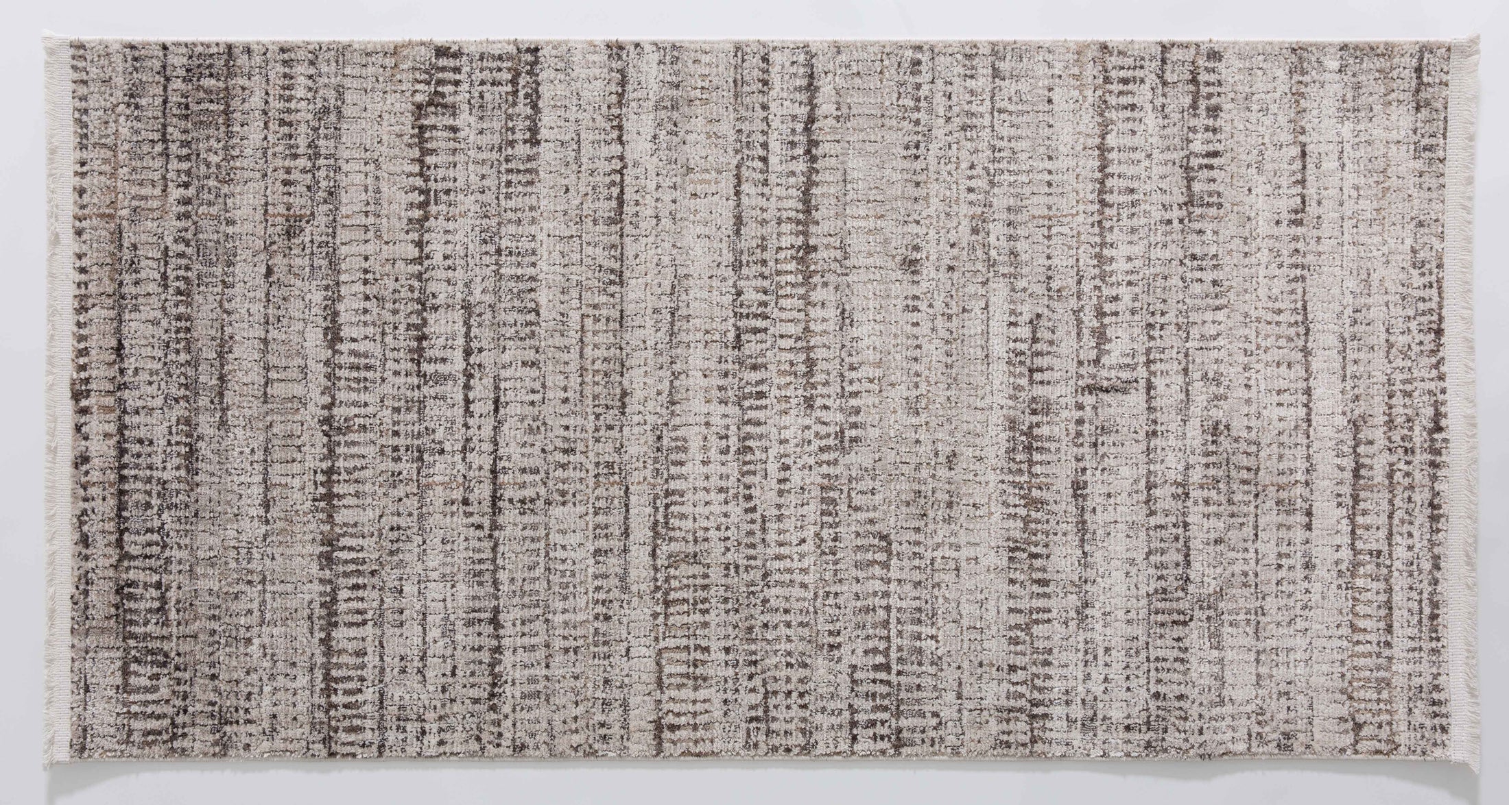 Halo Dune Area Rug in a finished interior.