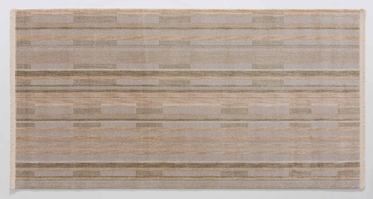 Infinitude Cairn Area Rug in a finished interior.