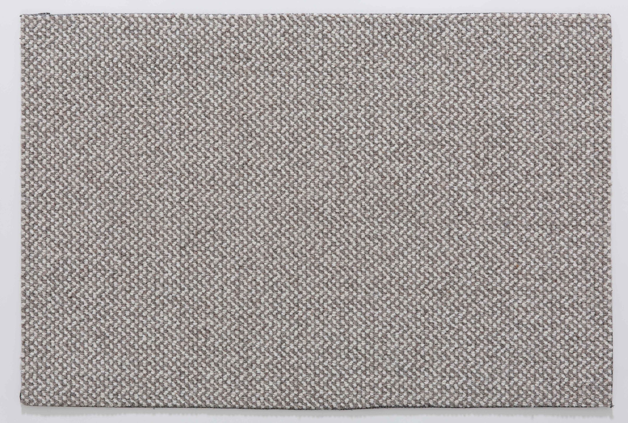 Plain Cairn Area Rug in a finished interior.