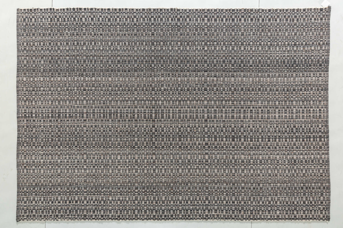 Oak Arc Area Rug in a finished interior.