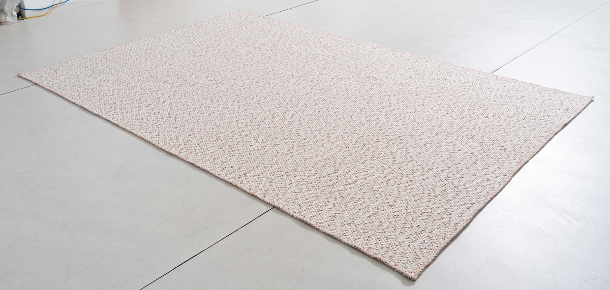 Luster Bloom Area Rug in a finished interior.