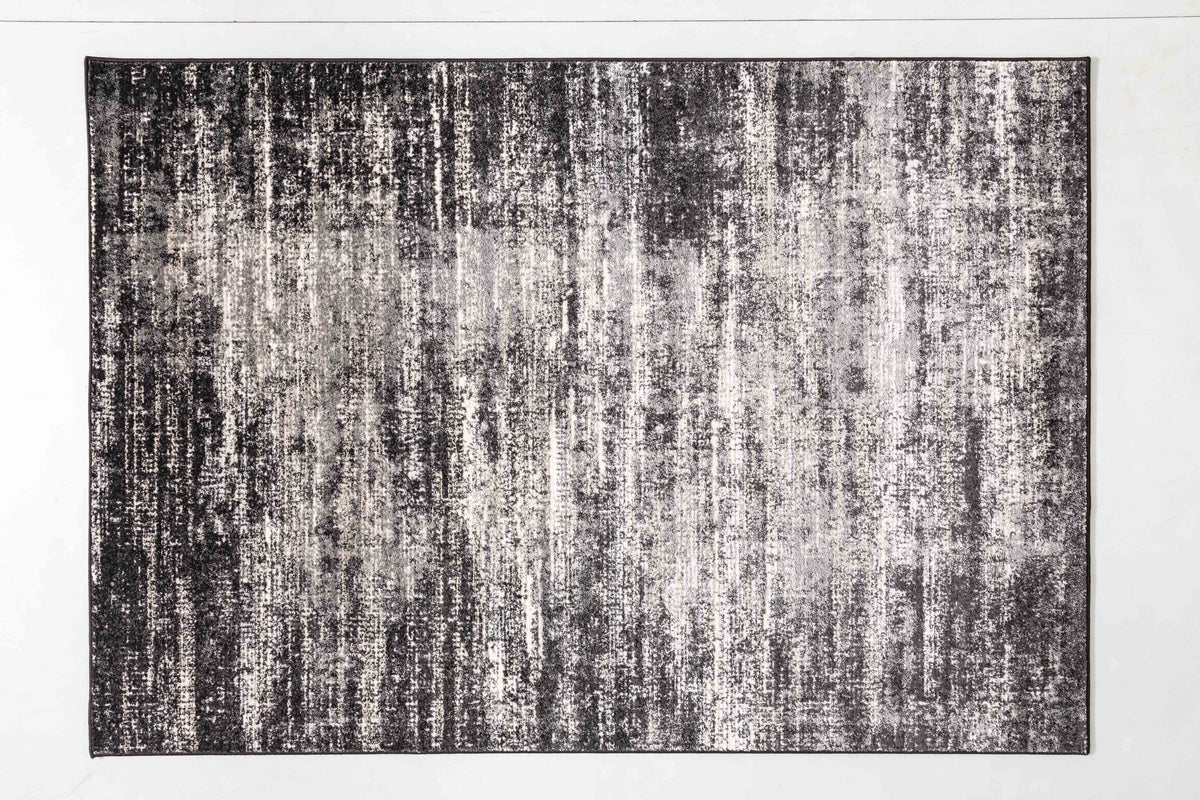 Grey Bloom Area Rug in a finished interior.