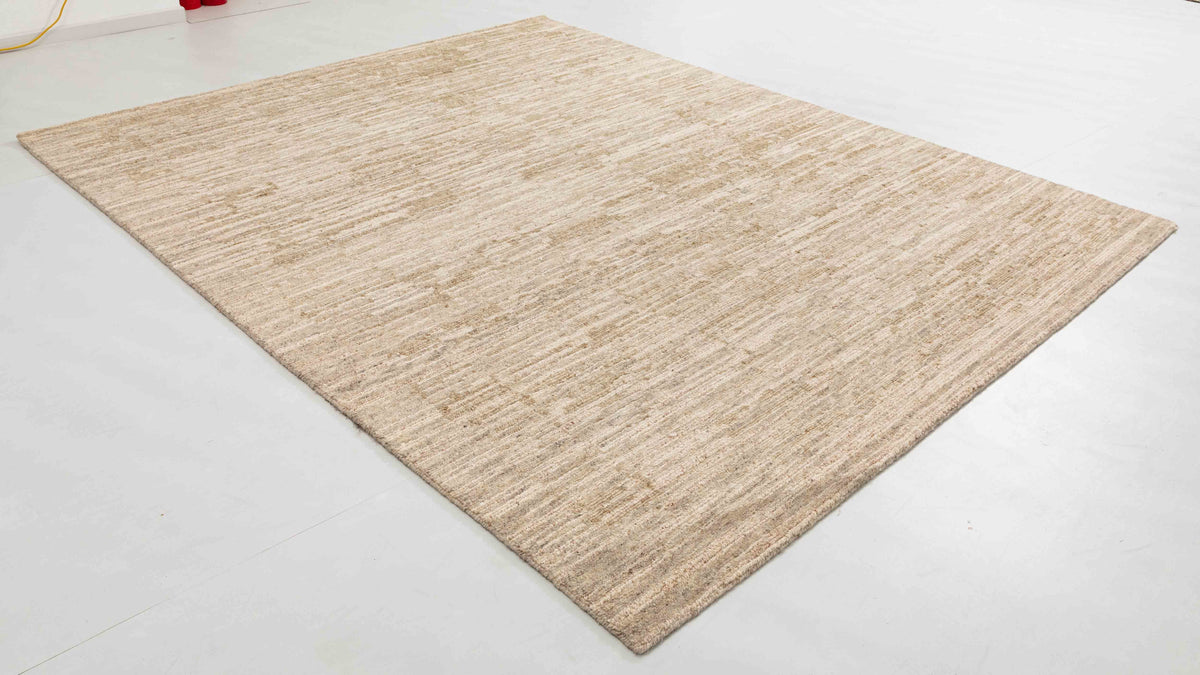 Moura Arc Area Rug in a finished interior.