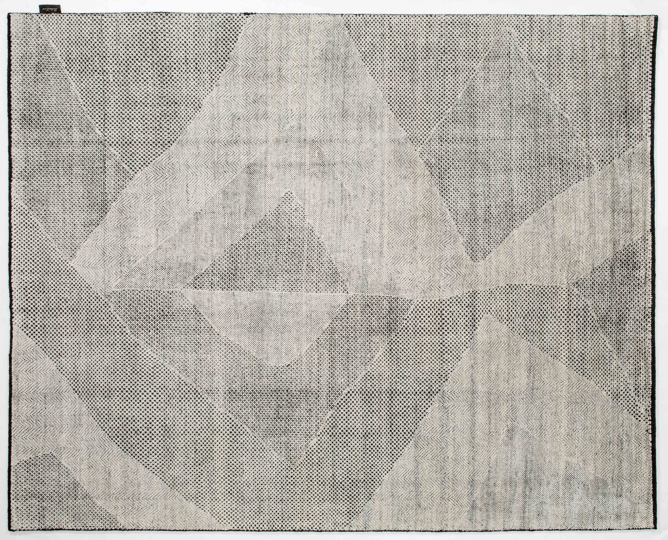 Interspace Bloom Area Rug in a finished interior.