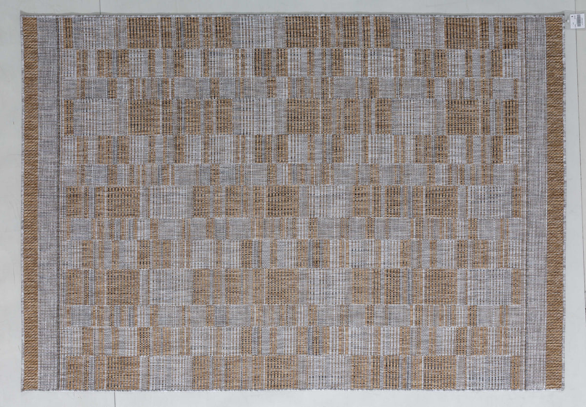 Palm Cairn Area Rug in a finished interior.