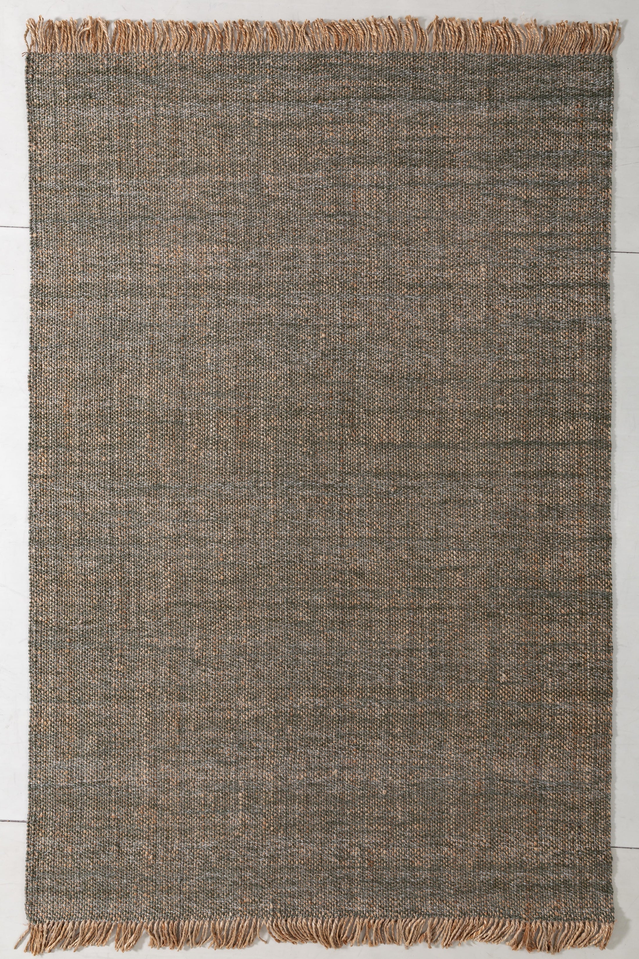 Natsuki Cairn Area Rug in a finished interior.