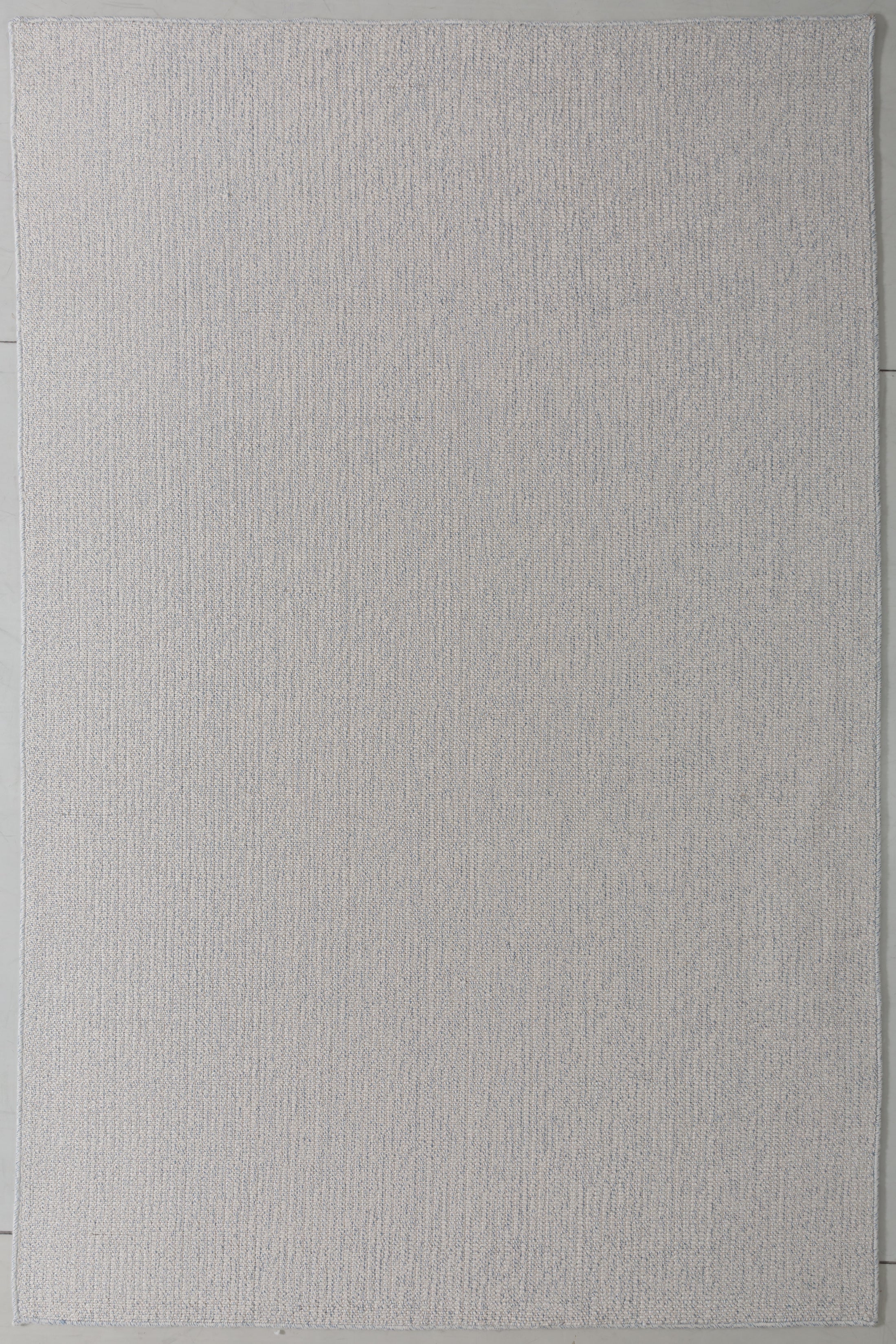 Luster Cove Area Rug in a finished interior.