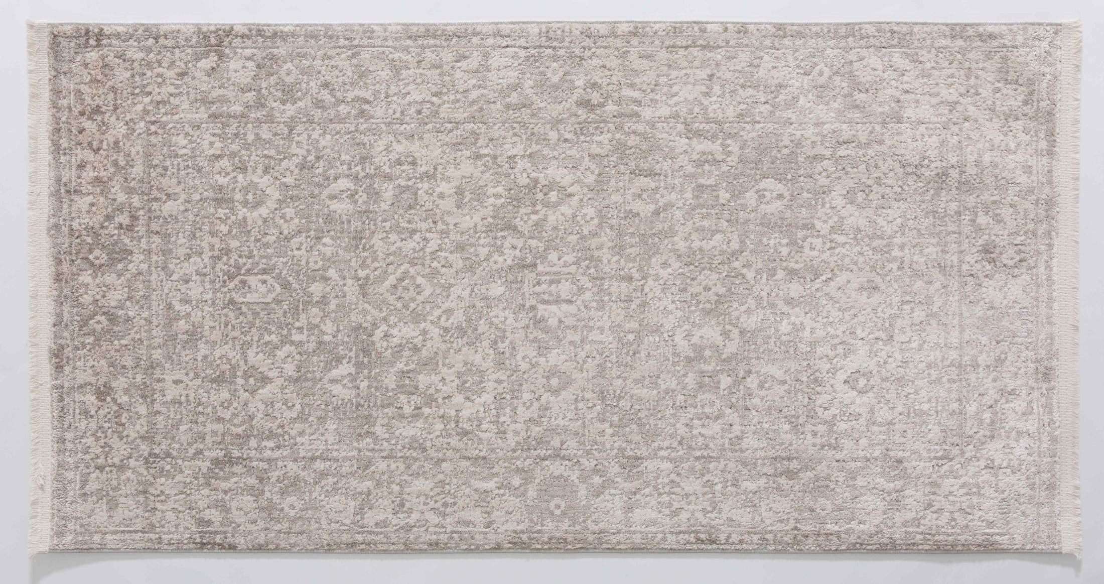 Halo Arc Area Rug in a finished interior.