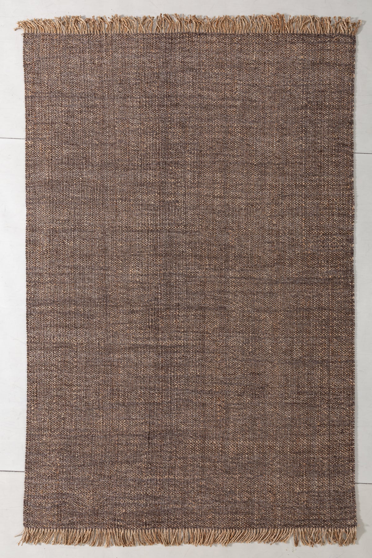 Natsuki Cove Area Rug in a finished interior.