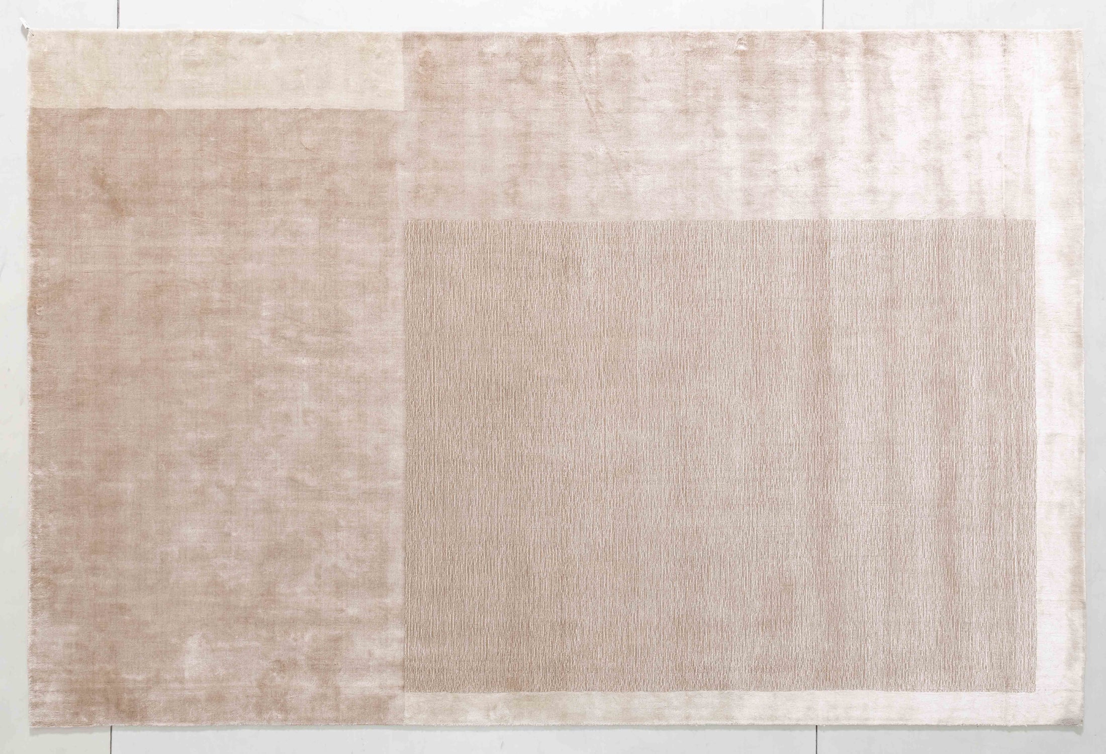 Symphony Cairn Area Rug in a finished interior.