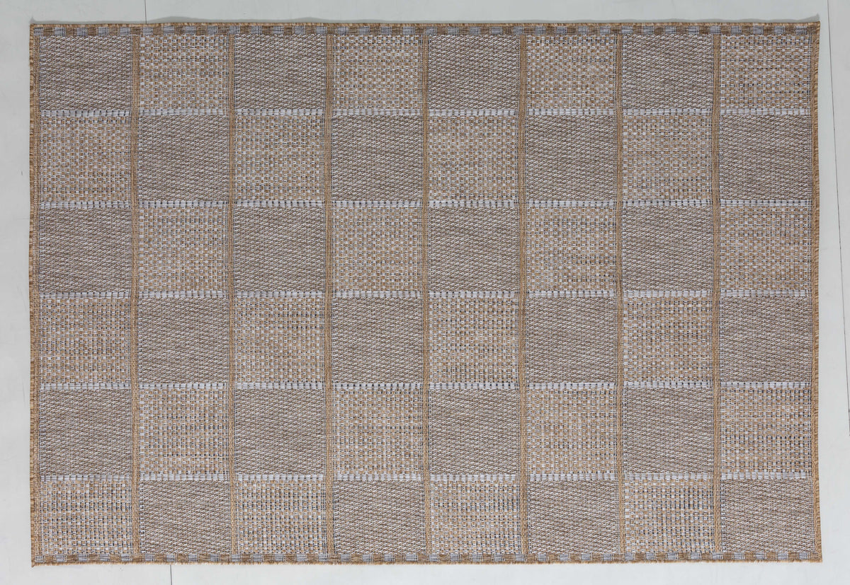 Palm Atlas Area Rug in a finished interior.