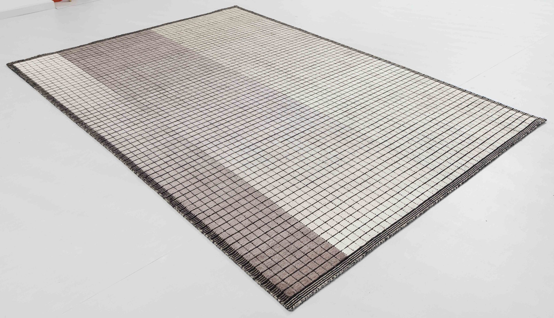 Neon Arc Area Rug in a finished interior.