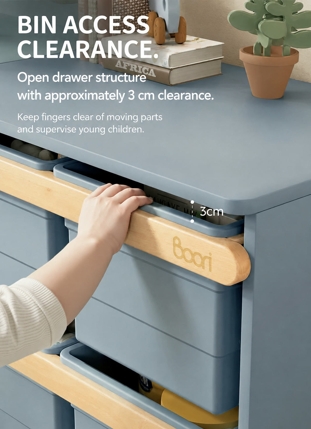  Storage bin access with a 3 cm finger gap