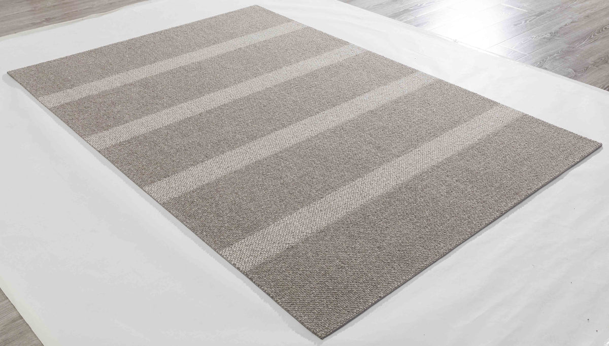 Breeze Arc Area Rug in a finished interior.