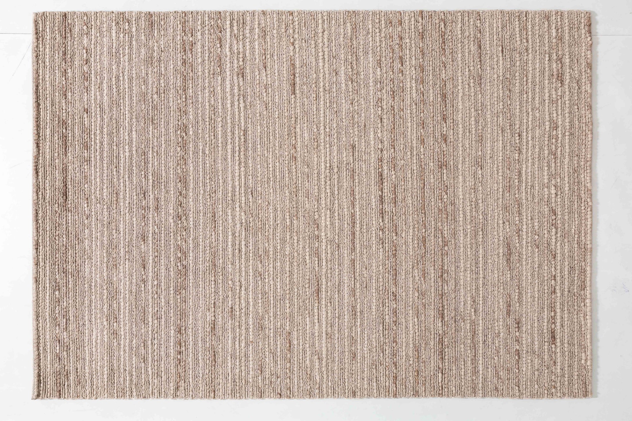 Pebble Arbor Area Rug in a finished interior.