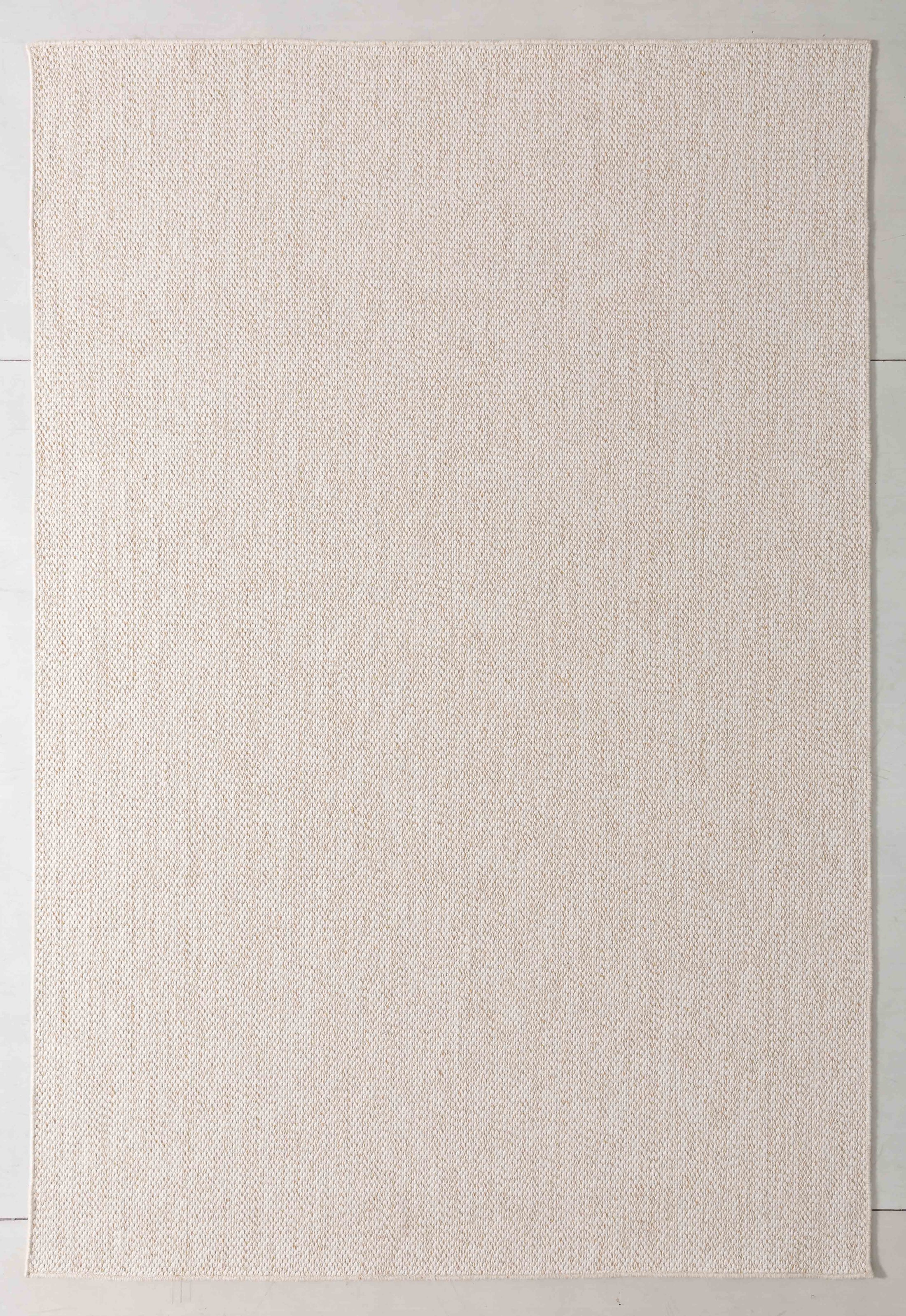 Luster Atlas Area Rug in a finished interior.