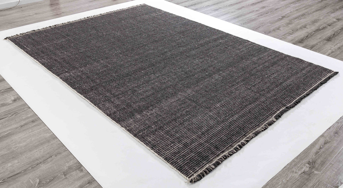 Minimalist Cairn Area Rug in a finished interior.
