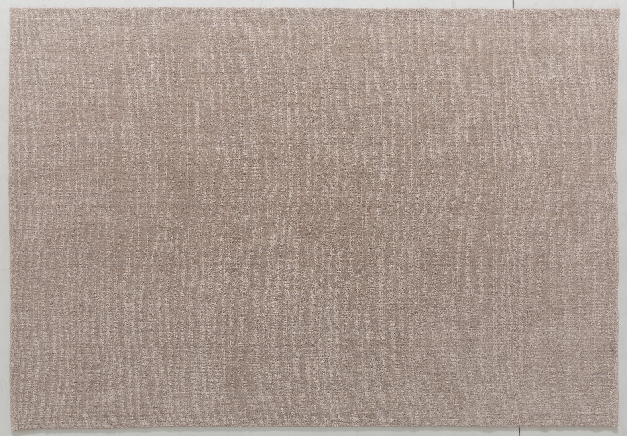 Silhouette Arc Area Rug in a finished interior.