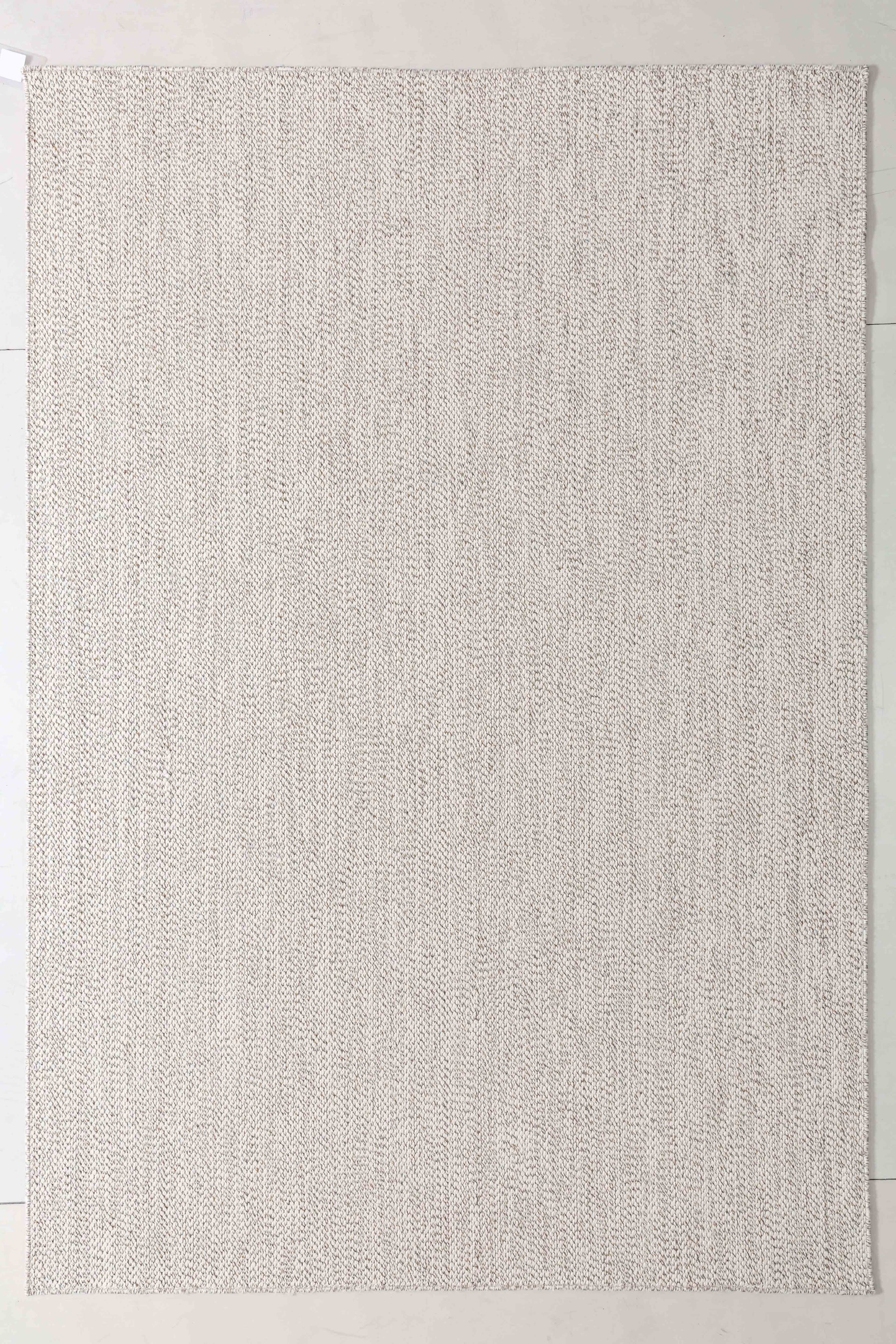 Luster Arc Area Rug in a finished interior.