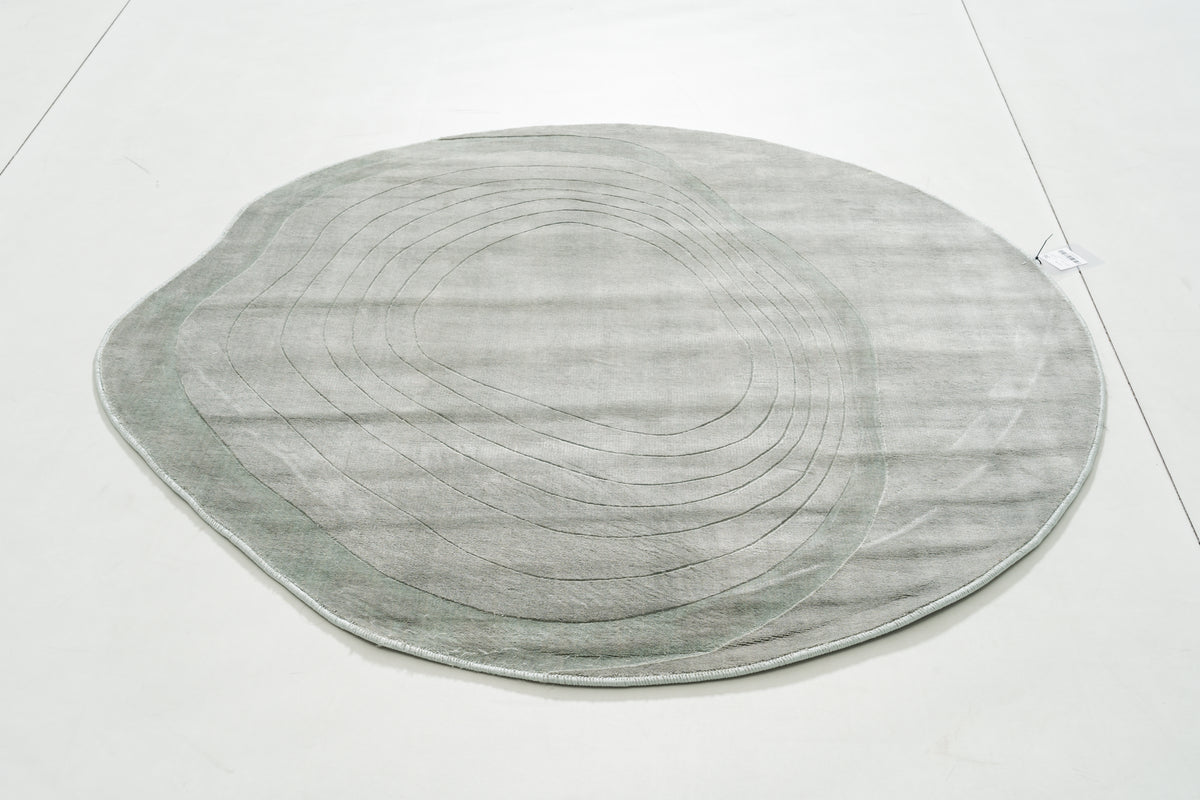 Teana Ember Area Rug in a finished interior.
