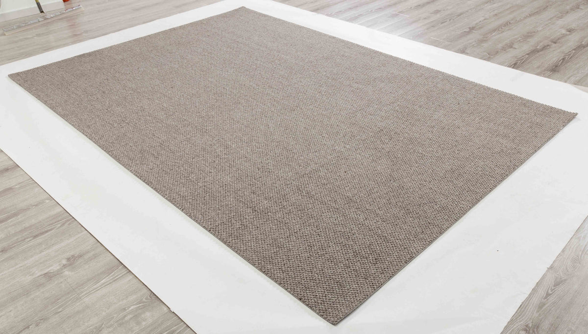 Plain Atlas Area Rug in a finished interior.