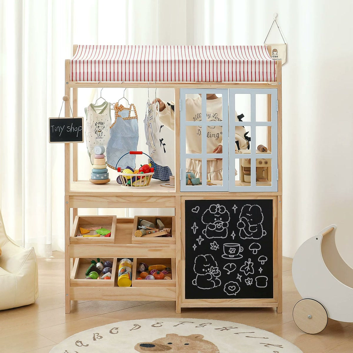 Pine play shop with striped canopy, open shelves and chalkboard