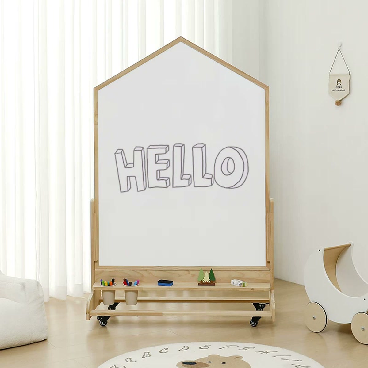 House-shaped magnetic whiteboard on a pine rolling base