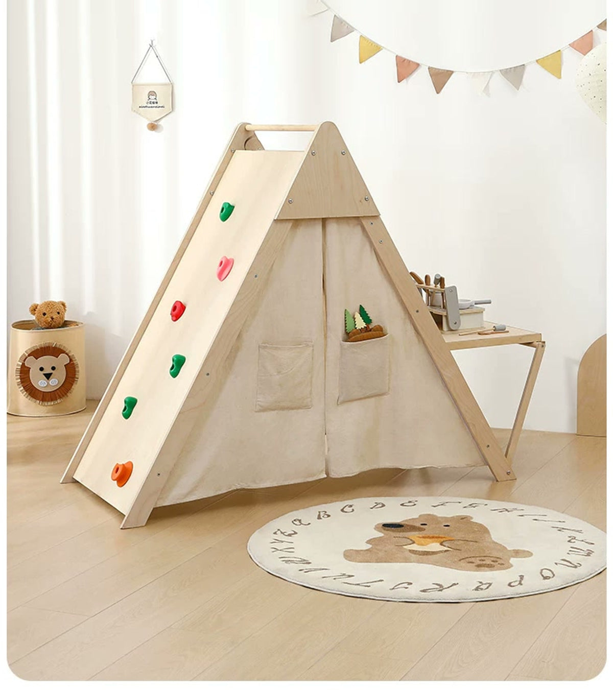 Unoccupied play tent viewed from the climbing-panel side with the desk open