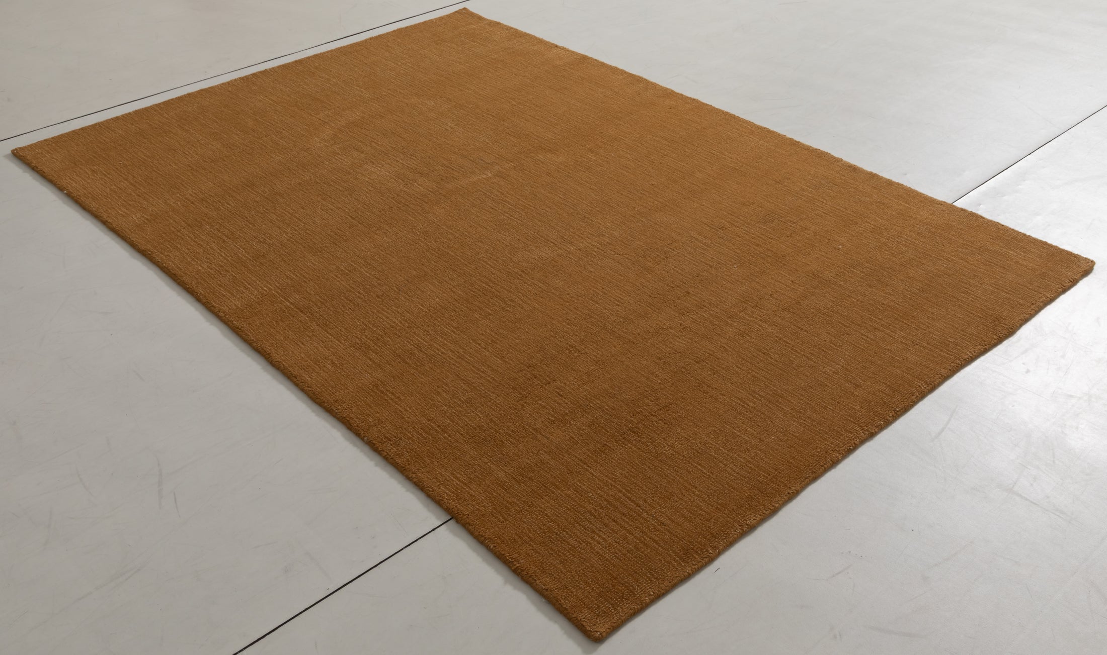 Silhouette Cairn Area Rug in a finished interior.