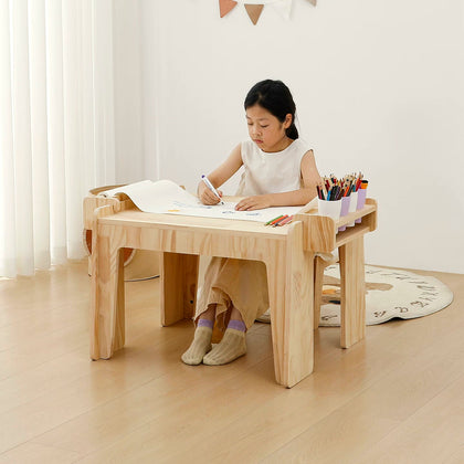  Child drawing at the fixed-height pine desk