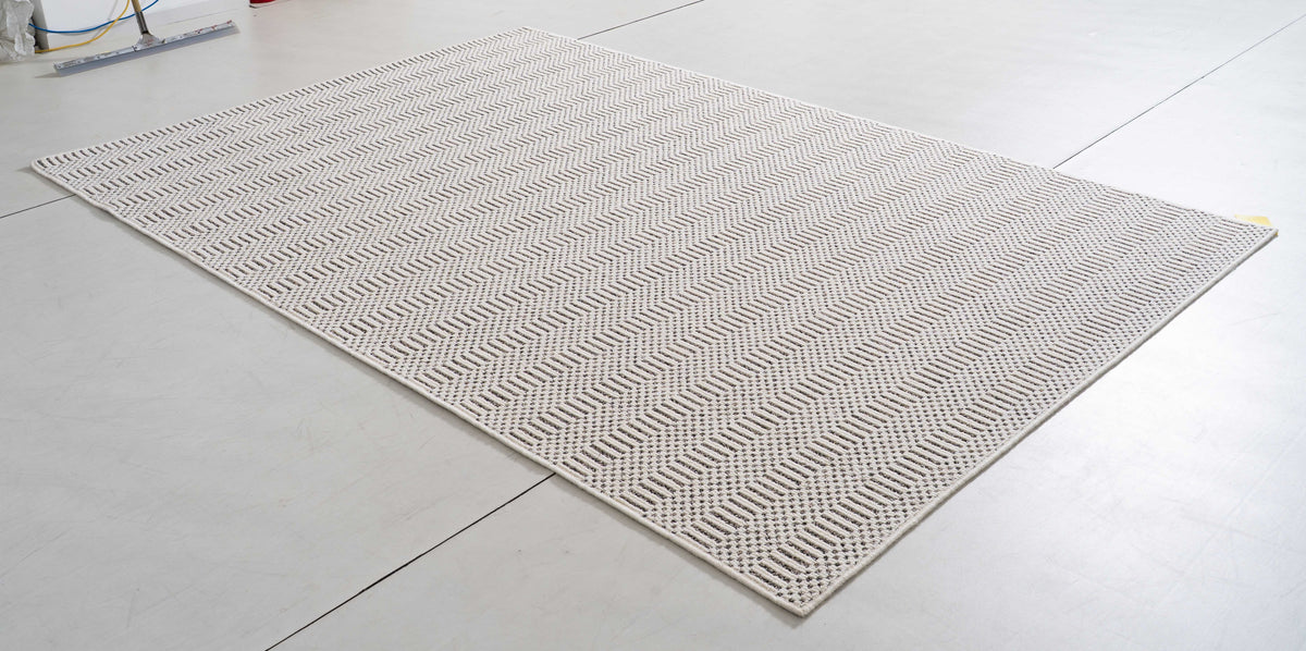 Midsummer Arc Area Rug in a finished interior.