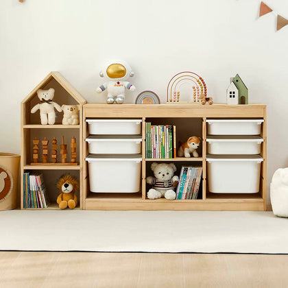  Pine house bookcase beside a low three-column cabinet with white pull-out bins