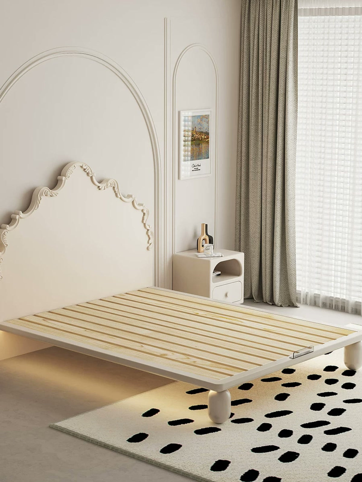  Uncovered pine slat base, front mattress retainer and rounded legs of the cream carved bed.